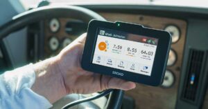 ELD electronic logging device tablet mounted in commercial truck cab recording hours of service data for FMCSA compliance and DOT regulatory requirements — Elite Logistics LLC