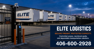 Elite Logistics trailers parked inside a well-lit commercial truck yard with security fencing and controlled gated access.