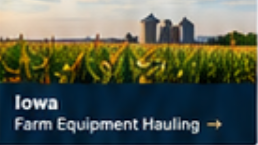 Iowa farm equipment hauling service by Elite Logistics, shown with a tall cornfield and grain silos at sunset