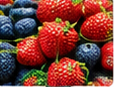 Close-up of fresh strawberries and blueberries ready for refrigerated produce trucking with Elite Logistics