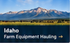 Idaho farm equipment hauling service by Elite Logistics, shown with green farmland and a tree line below snow-capped mountains